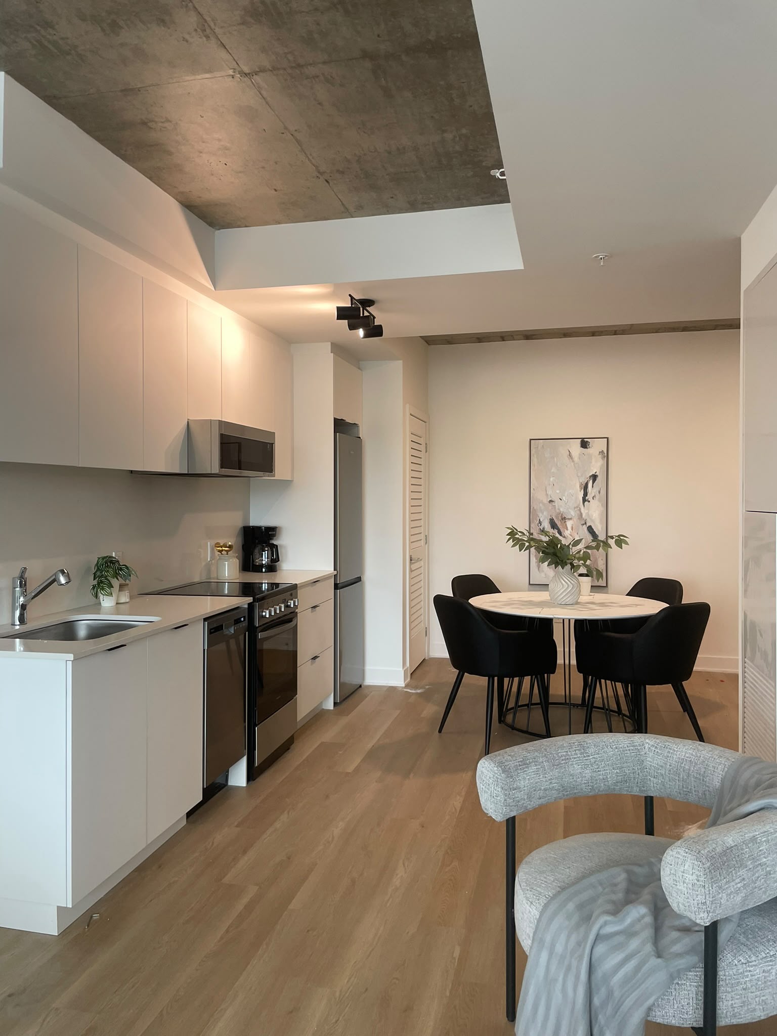 Furnished apartment kitchen and dining area ready for everyday use